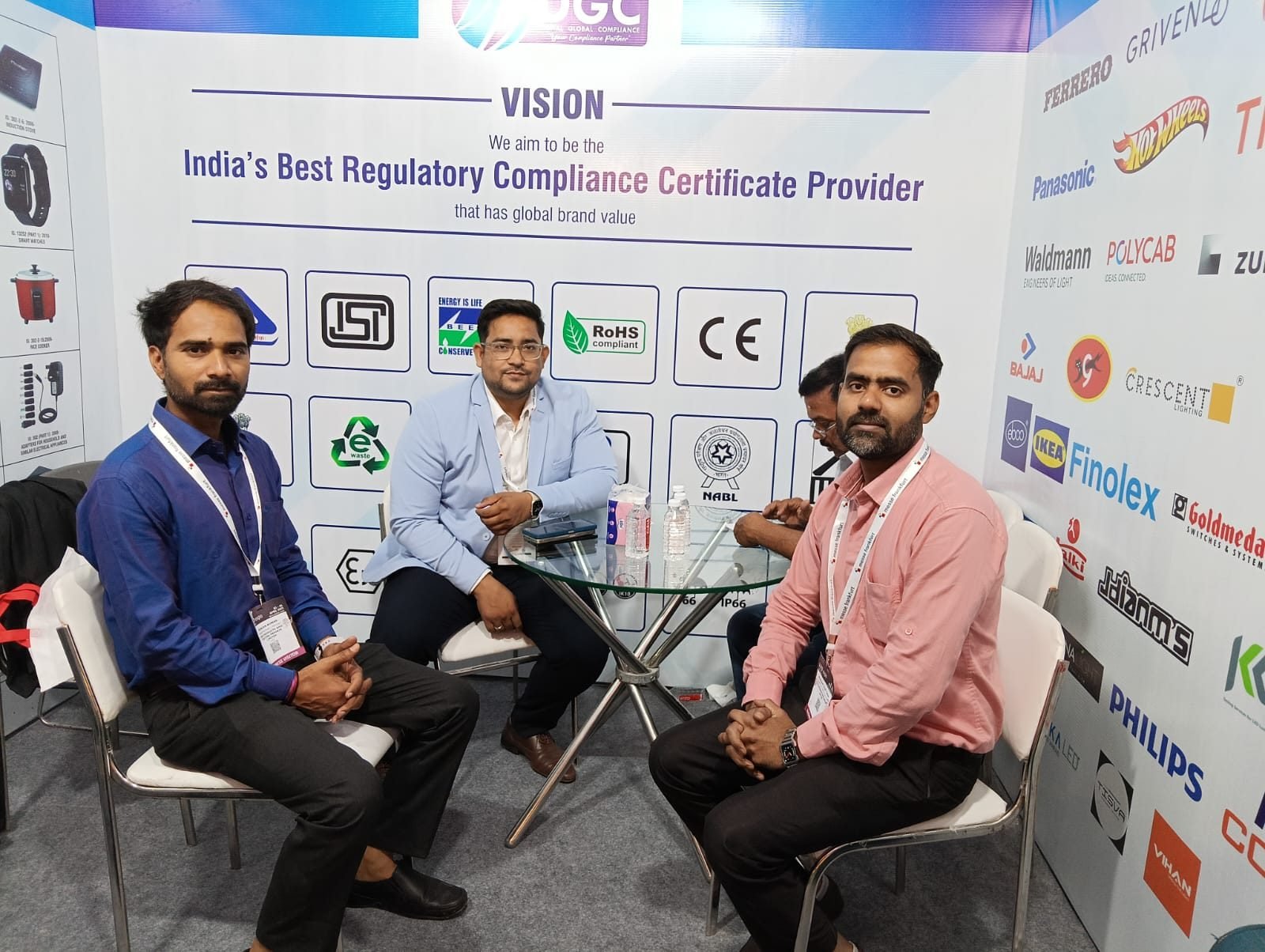 DGC team members seated at the expo booth